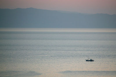 High angle view of ship sailing on sea against clear sky