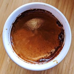 High angle view of coffee in cup on table