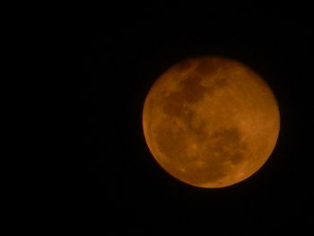 Low angle view of moon against clear sky at night