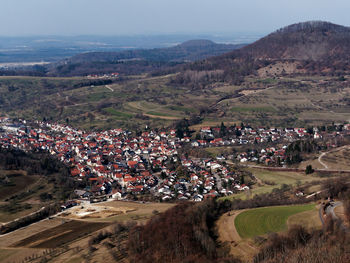 High angle view of people on landscape against sky