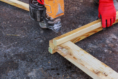 Low section of worker working at construction site