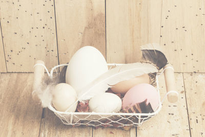 High angle view of stuffed sleeping in basket on table