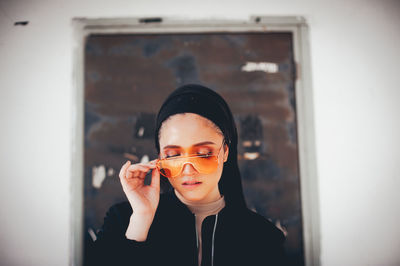 Portrait of a young woman holding glass