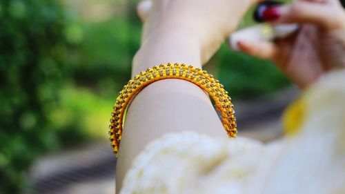 Cropped hand wearing bangle