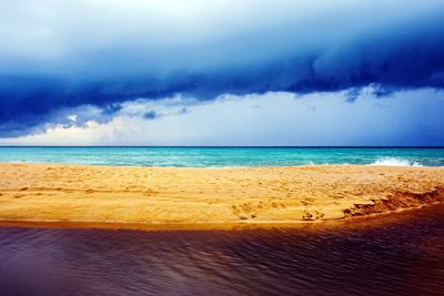 Scenic view of beach against sky