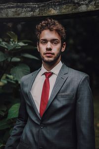 Portrait of young man standing outdoors