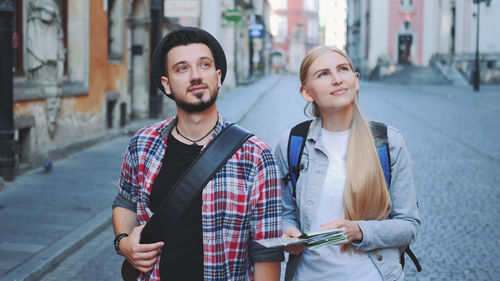 Young couple on street in city