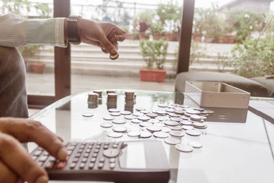 Cropped hands counting coins