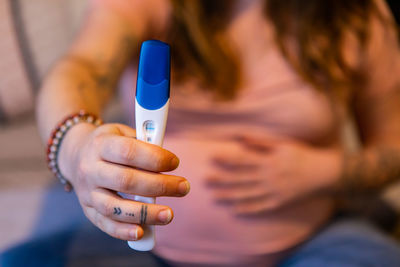 Close-up of woman holding hands