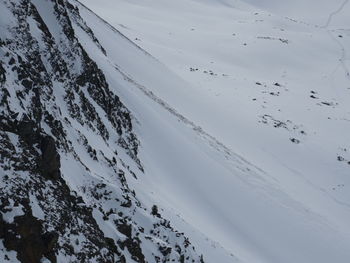 High angle view of snow covered mountain against sky