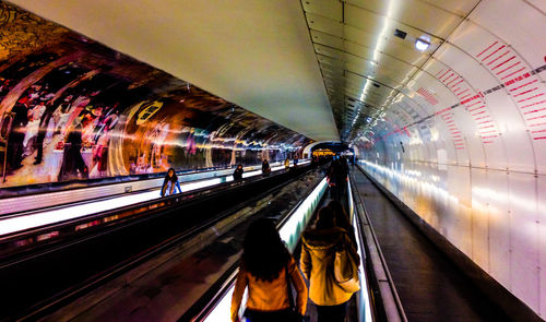 Rear view of people at railroad station