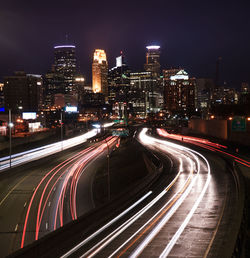 High angle view of light trails on road at night