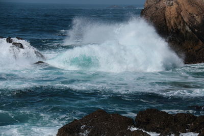 Waves splashing on rocks