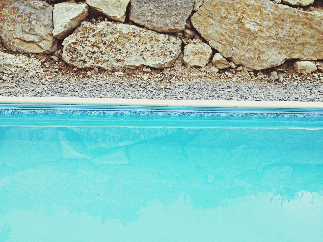 blue, textured, wall - building feature, close-up, day, pattern, wall, backgrounds, outdoors, full frame, beach, no people, sunlight, sea, built structure, turquoise colored, rough, part of, architecture, detail