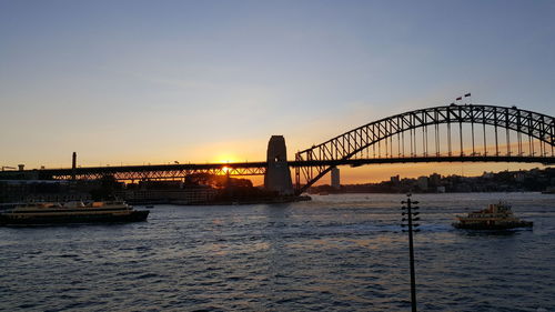 View of bridge over river in city