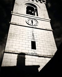 Low angle view of clock tower against sky