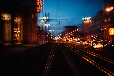 Defocused image of illuminated city street at night