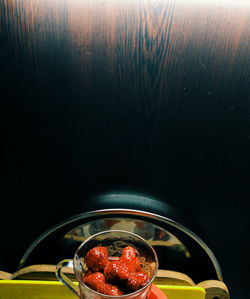 High angle view of strawberries in glass bowl on table