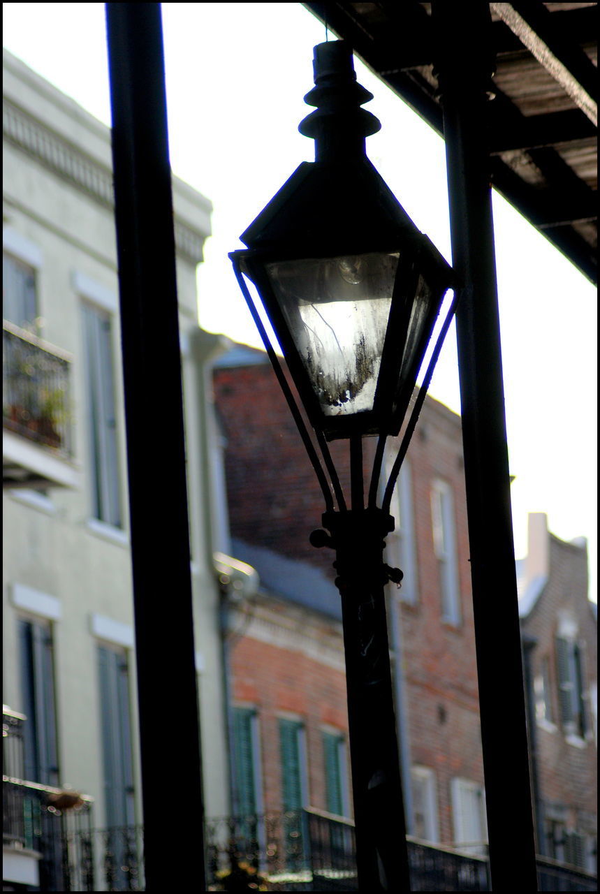 LOW ANGLE VIEW OF ILLUMINATED STREET LIGHT AGAINST SKY