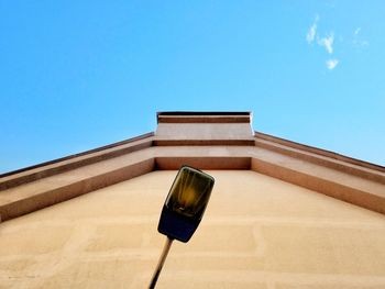 Low angle view of building against blue sky