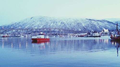 Calm lake with mountains in background