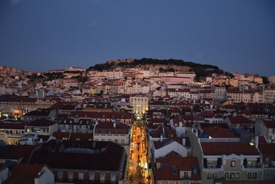 View of buildings in city at dusk