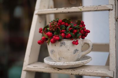 Close-up of red rose on table