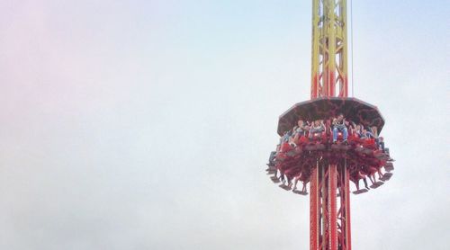 Low angle view of carousel against clear sky