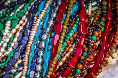 Close-up of multi colored jewelry for sale in market