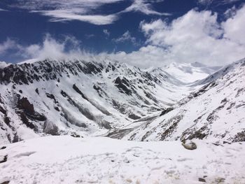 Scenic view of snowcapped mountains against sky