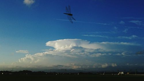 Airplane flying over landscape