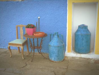 Empty chairs against wall
