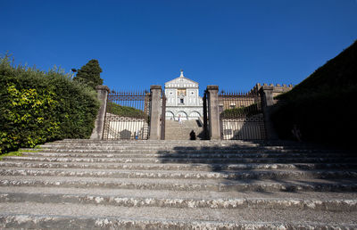 Exterior of historic building against blue sky