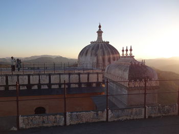 View of temple building against sky during sunset