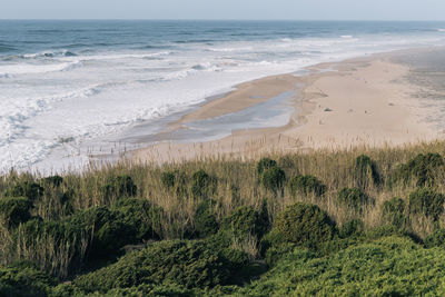 Scenic view of beach against sky