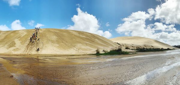 Panoramic view of desert against sky