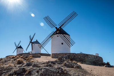 Traditional windmills against clear sky