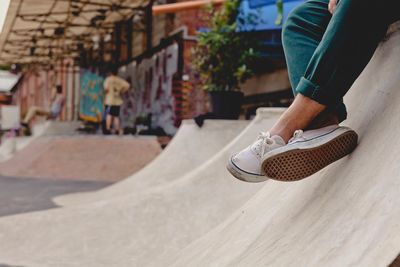 Low section of man wearing shoes