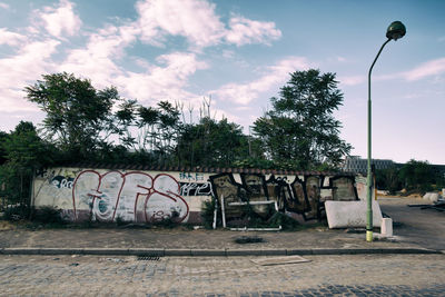 Road by graffiti wall