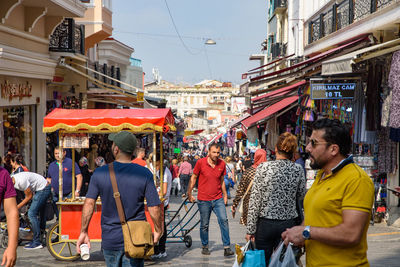 People walking on street in city