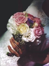 Close-up of hand holding bouquet