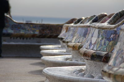 Close-up of rusty metallic structure in sea against sky