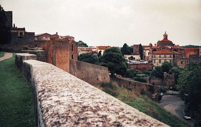 View of buildings in town against sky