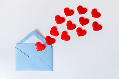 Close-up of heart shape over white background