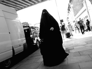 PEOPLE WALKING IN CITY