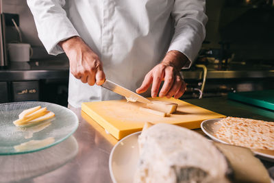 Midsection of man preparing food