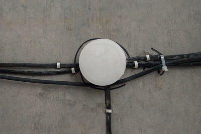 High angle view of electric lamp on table against wall