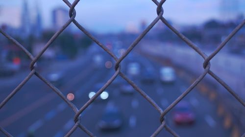 Close-up of chainlink fence during winter