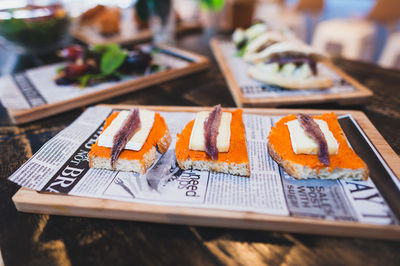 Close-up of open faced sandwich on plate at restaurant