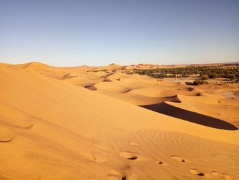 Scenic view of desert against clear sky